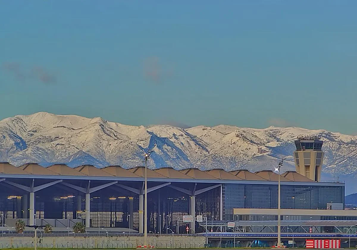 Snow covers mountains behind Malaga's Costa del Sol