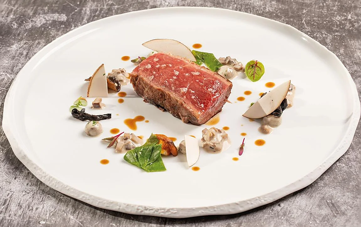 Blanqueta de cerdo y 'champis' cremosos