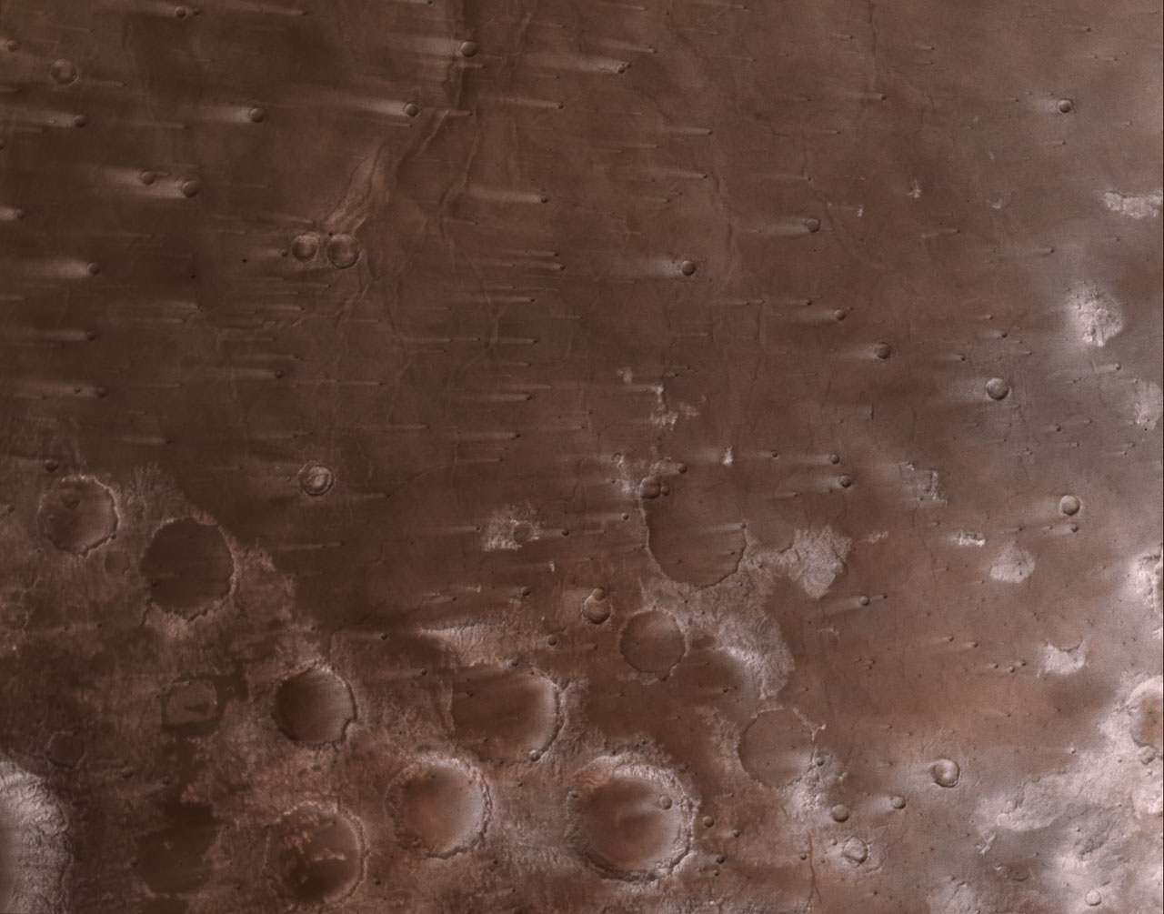 NASA’s Psyche Mission Spies Mars’ Wind-Blown Craters During Close Approach